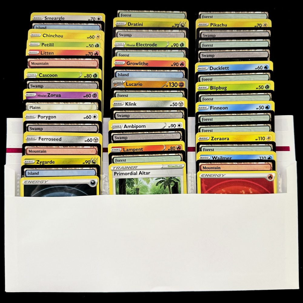 Trading card shipping envelope loaded with 50 cards fanned in its 3 built-in pockets